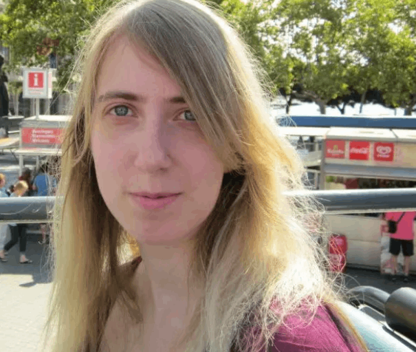 image Woman with long blonde hair, outdoors.